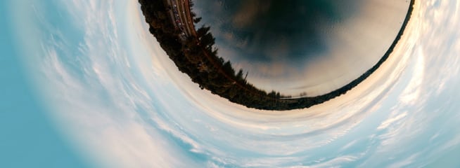 A warped view of a coastline seen through a fisheye lens